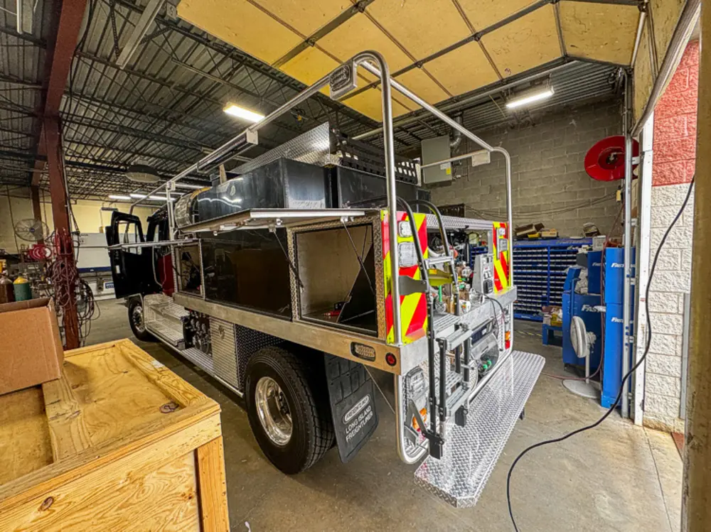Apparatus in production bay with hood open, photo 21 of 303.